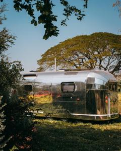 a train car sitting on the tracks in a field at Moyard Khaoyai in Ban Khanong Phra Klang (1)