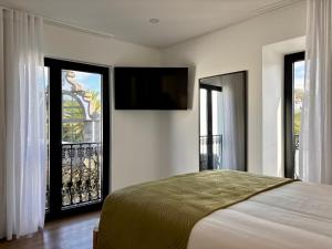 Ένα ή περισσότερα κρεβάτια σε δωμάτιο στο Azores Homes Resort & Spa +108 φωτογραφίες