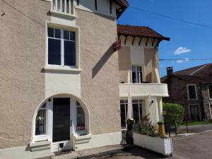 a building with a large window on the side of it at L'Arc en Ciel in Bleurville