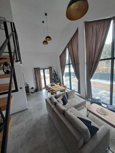 a living room with a couch and a table at Chalet Habovka in Habovka