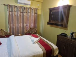 Ένα ή περισσότερα κρεβάτια σε δωμάτιο στο Hotel K I