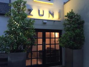 a building with a sign that reads zum at Zuni Restaurant & Boutique Hotel in Kilkenny