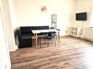 a dining room with a table and chairs at Worker's Apartment in Leverkusen L1-4 in Leverkusen