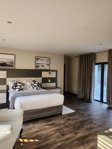 Ένα ή περισσότερα κρεβάτια σε δωμάτιο στο Diamond and Pearl Holiday Home +85 φωτογραφίες