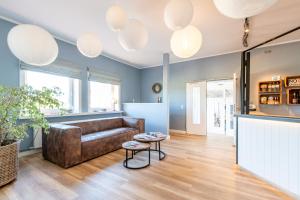 a living room with a couch and a table at Steger-Hüs Wohnung 41 in Rantum