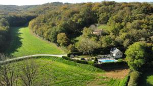 an aerial view of a house in the middle of a field at Canterane, un coin de paradis à la campagne in Salignac Eyvigues