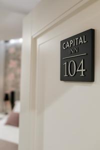 Postel nebo postele na pokoji v ubytování Hotel Capital Inn Tirana