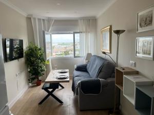 a living room with a couch and a table at Mirador de Sanlucar 3 in Sanlúcar de Barrameda