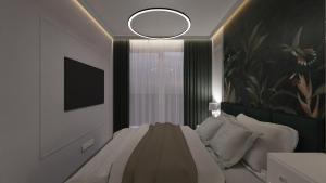 a bedroom with a bed and a mirror on the wall at Royal Blue & Royal Green in Opole +2 photos