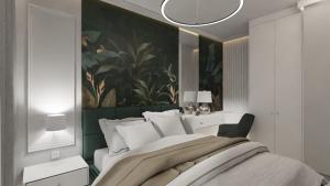 a bedroom with a large bed with a painting on the wall at Royal Blue & Royal Green in Opole