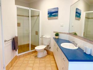 a bathroom with a toilet and a sink and a shower at Troon Retreat! Golf, Wineries, beaches in Dunsborough +25 photos