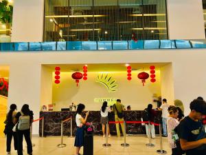 a group of people standing in a lobby at Summer Suites KLCC By City Home Style in Kuala Lumpur +71 photos