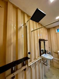 a bathroom with a sink and a mirror at Pok Mat Beach Cabin in Marang
