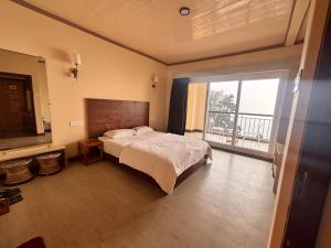 Postel nebo postele na pokoji v ubytování Asraya Homestay