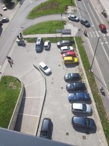 a bunch of cars parked in a parking lot at ILiDZA SKY in Sarajevo