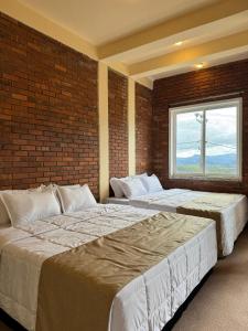 Postel nebo postele na pokoji v ubytování Cloudscape Breeze + 11 fotografií