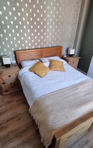 a bedroom with a large bed with two night stands at The Old Bakery in Lincoln