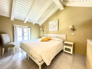 Postel nebo postele na pokoji v ubytování IRIS 2 lago di Como + 37 fotografií