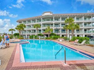 a pool in front of a hotel at Inn at Seacrest 309- Somewhere in the Sun in Inlet Beach
