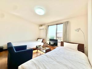 Postel nebo postele na pokoji v ubytování サンライズ + 7 fotografií