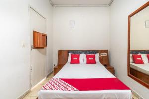 Postel nebo postele na pokoji v ubytování OYO Hotel Dom Pedro, São Paulo