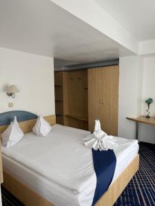 Postel nebo postele na pokoji v ubytování BRIZA Boutique Hotel Mamaia