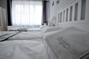 
Łóżko lub łóżka w pokoju w obiekcie Apartamenty Wadowity 4A
