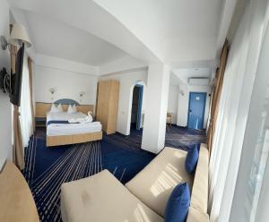 Postel nebo postele na pokoji v ubytování BRIZA Boutique Hotel Mamaia