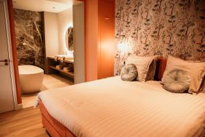 Postel nebo postele na pokoji v ubytování Fortuna Suites
