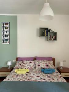 Ένα ή περισσότερα κρεβάτια σε δωμάτιο στο Nutshell apt Monza Parco, Centro, Policlinico