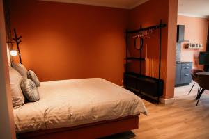Postel nebo postele na pokoji v ubytování Fortuna Suites