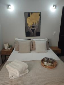 a bedroom with a bed with a tray on it at Mary's Cozy apartment in Alexandroupoli