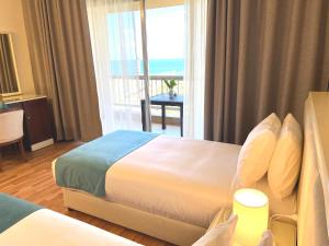 Voodi või voodid majutusasutuse Hotel Méditerranée Beyrouth toas