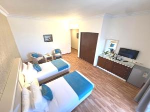 Televiisor ja/või meelelahutuskeskus majutusasutuses Hotel Méditerranée Beyrouth