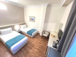 Voodi või voodid majutusasutuse Hotel Méditerranée Beyrouth toas