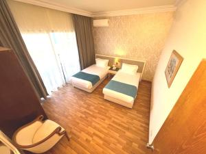 Voodi või voodid majutusasutuse Hotel Méditerranée Beyrouth toas
