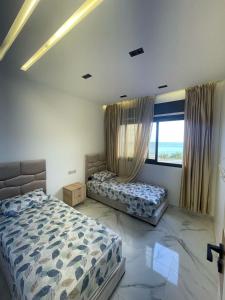 Postel nebo postele na pokoji v ubytování Oumaira Residence Azla-Tetouan + 31 fotografií