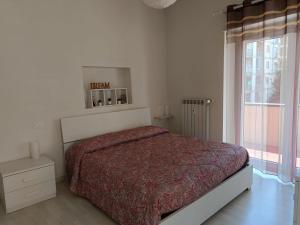 A bed or beds in a room at LA CASA DEI NONNI