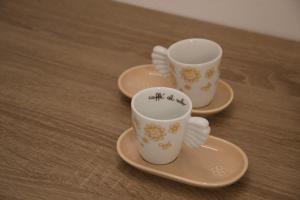 three cups and saucers sitting on a table at La Casa di Alice in Perugia