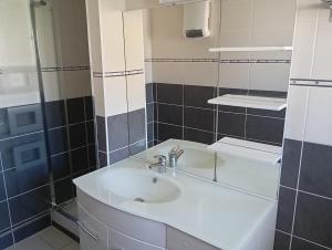 a bathroom with a sink and a mirror at "Les Tournesols" in Saint-Martin-dʼArdèche +23 photos