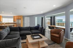 a living room with a couch and a table at Private Beach, Close To Everything in South Lake Tahoe