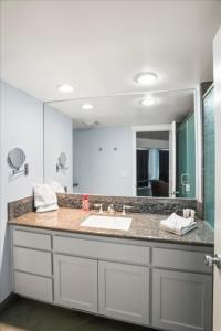 a bathroom with a sink and a large mirror at Private Beach, Close To Everything in South Lake Tahoe +19 photos