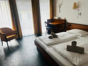 Postel nebo postele na pokoji v ubytování Hotel am Malerwinkel