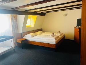 Postel nebo postele na pokoji v ubytování Hotel am Malerwinkel