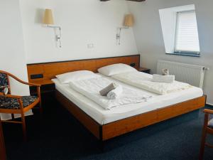 Postel nebo postele na pokoji v ubytování Hotel am Malerwinkel