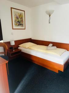 Postel nebo postele na pokoji v ubytování Hotel am Malerwinkel