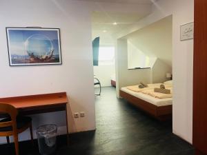 Postel nebo postele na pokoji v ubytování Hotel am Malerwinkel
