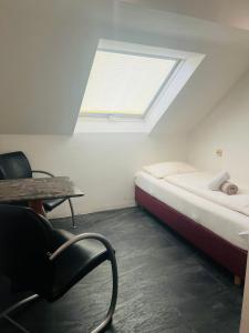 Postel nebo postele na pokoji v ubytování Hotel am Malerwinkel