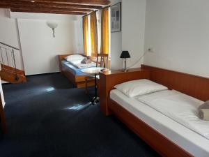 Postel nebo postele na pokoji v ubytování Hotel am Malerwinkel