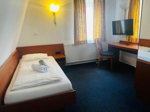 Postel nebo postele na pokoji v ubytování Hotel am Malerwinkel